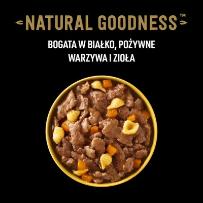 NATURAL GOODNESS. Bogata w białko, pożywne warzywa i zioła. Miska z kawałkami mięsa, żółtymi i pomarańczowymi warzywami w sosie.