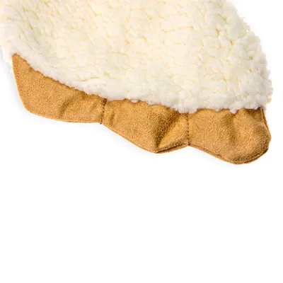 Close-up view of a product with white plush material and brown suede fabric. Suitable for product description or material presentation.