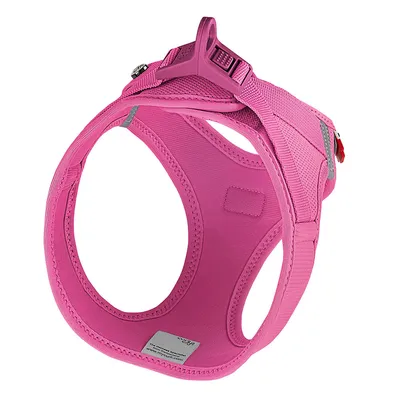 Pink dog harness with sturdy buckle, padded material and reflective details. Label with manufacturer information visible.