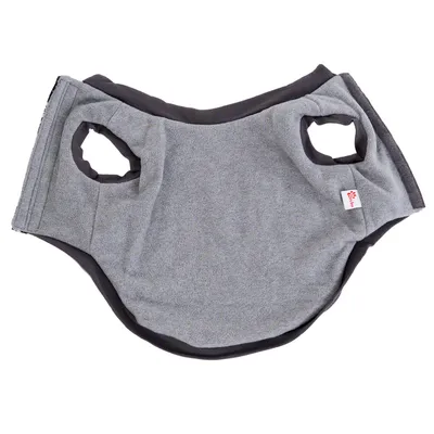 Grey pet vest with two leg holes and a small fabric tag, shown laid flat to display shape and openings.