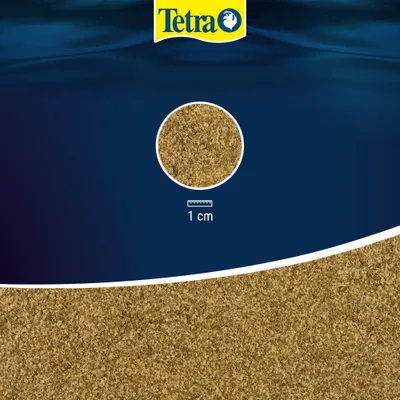 Tetra Flockenfutter, Detailansicht der Flockengröße mit Maßstab 1 cm. Tetra Flockenfutter, Detailansicht der Flockengröße mit Maßstab 1 cm.
