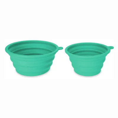 Two foldable green silicone bowls with ribbed design and side handle. Suitable for travel or on the go.