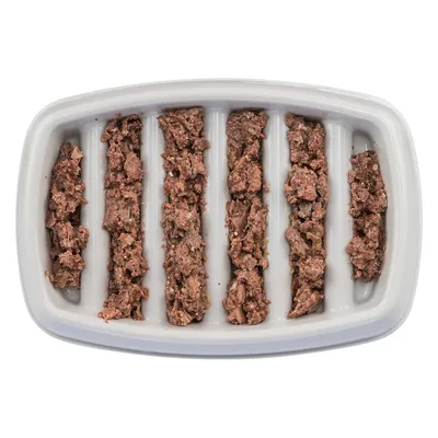 Close-up of wet food in a white bowl with six vertical compartments, evenly distributed.