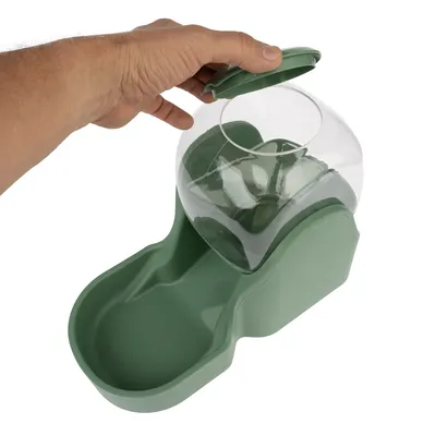 Green feeder with transparent dome, opened by one hand. Suitable for automatic feeding of pets.