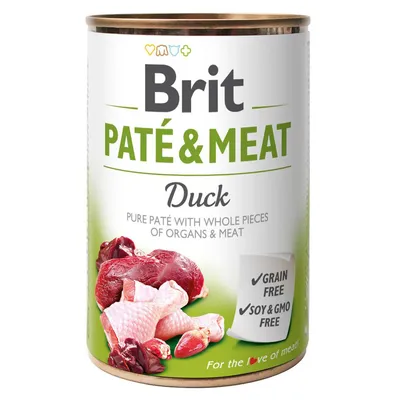 Brit Paté & Meat Duck, paté con pezzi di carne e organi di anatra. Testo visibile: Grain free, Soy & GMO free. Immagine di carne cruda di anatra sulla confezione.