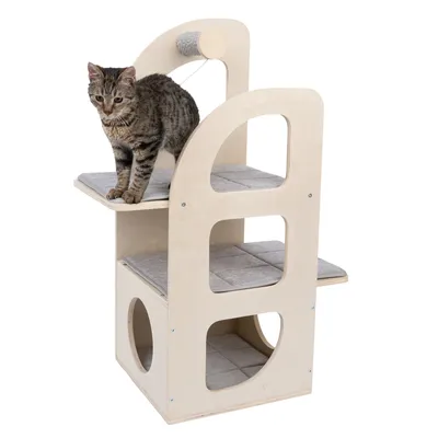 Wooden cat furniture with three levels, grey padded surfaces and integrated scratching toy. Cat is standing on the top level.