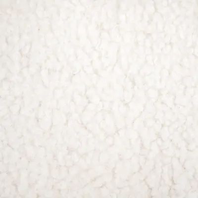 Close-up of white, soft fleece material with textured surface.