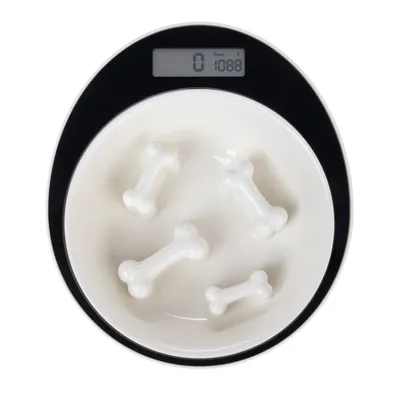 White feeding bowl with bone-shaped elevations, digital display shows weight: 1088 g.