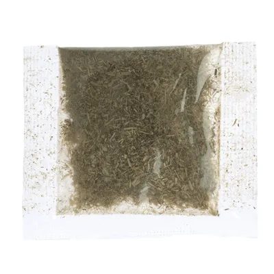 Transparent pouch with dried herbs, visible through the packaging.