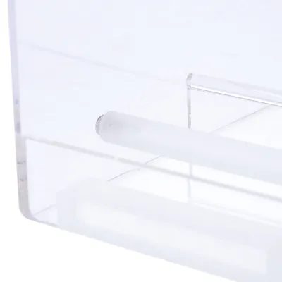 Transparent plastic material with a white cylindrical rod. Product close-up view.