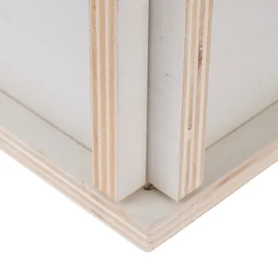 Close-up of a laminated wood structure with clear edges and a light surface.