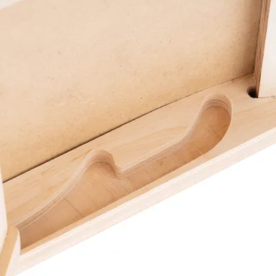 Close-up view of a wooden recess, suitable for placing items. Material: light wood with a smooth surface.
