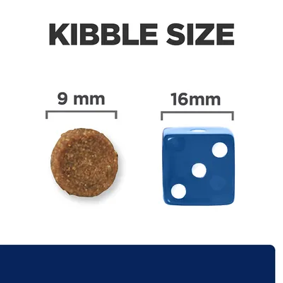 Kibble size comparison showing a 9mm round kibble next to a 16mm blue dice for scale.