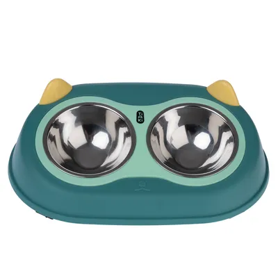 Double bowl made of stainless steel with green plastic frame and yellow accents, brand Tiki.