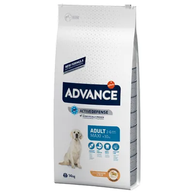 Опаковка Advance Active Defense Adult Maxi 2–6 години, над 30 кг, с пиле и ориз, 14 кг. Видим е голямо куче и информация за нова формула и основни ползи.