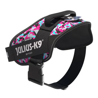 Julius-K9 IDC Power-Geschirr mit pink-türkisem Camouflage-Muster und schwarzem Gurtband, sichtbarer Markenname auf der Seite.