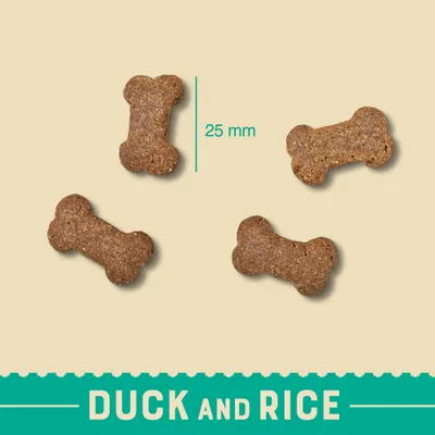 Bone-shaped kibble pieces with a size reference of 25 mm, labelled as duck and rice.