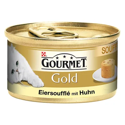 Scatoletta Gourmet Gold Eiersoufflé mit Huhn, immagine di un gatto bianco e soufflé su piattino. Testo in tedesco sull'etichetta.