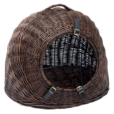 Brown wicker basket with metal grid door and two black leather straps with buckles, suitable as transport or resting place.