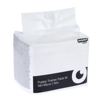 zooplus basics Puppy Trainer Pads M, 56×56 cm, 50 unités, emballage visible avec texte en anglais sur le côté