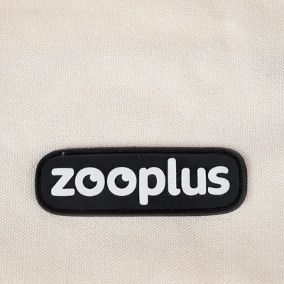 zooplus. Logo del marchio su sfondo in tessuto beige.