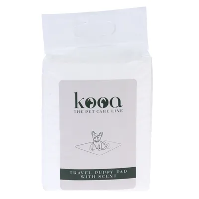 kooa The Pet Care Line. Travel Puppy Pad with Scent, Verpackung mit Illustration eines Hundes auf einer Matte.