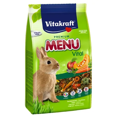 Vitakraft Premium Menu Vital, för dvärgkanin. Synliga symboler: vitamins, dental, high fibre, odour stop. Bild på kanin samt grönsaker och foderblandning på förpackningen.