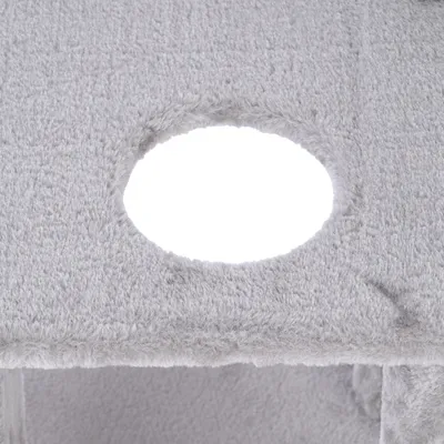 Grey plush fabric with round cut-out, part of a scratching post design.