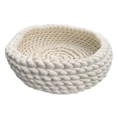 Panier rond tressé en tissu épais blanc, sans marque visible, bords hauts et structure souple.