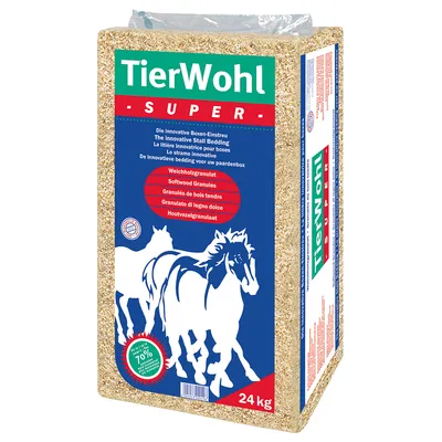 TierWohl SUPER pehmäpuugranaulat, 24 kg. Teksti: Softwood Granules, The innovative Stall Bedding. Kuvassa kaksi hevosta. Pakkauksessa maininta 70 % pölyttömyys.