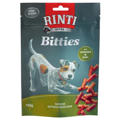 RINTI Extra Bitties, 100g, morceaux tendres de canard avec ananas et kiwi, sans sucre, texte en allemand sur l’emballage.