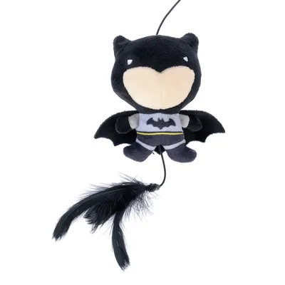 Black plush toy in bat design with Batman logo and black feathers at the bottom, hanging from a string.