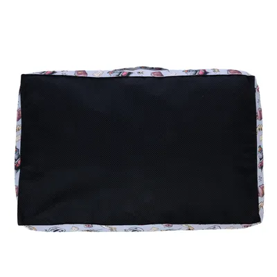 Vue de dessus d’un coussin rectangulaire noir avec bords à motifs colorés, surface en tissu. Aucun texte ou marque visible.