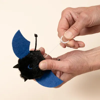 TIAKI gatto giocattolo vibrante pipistrello