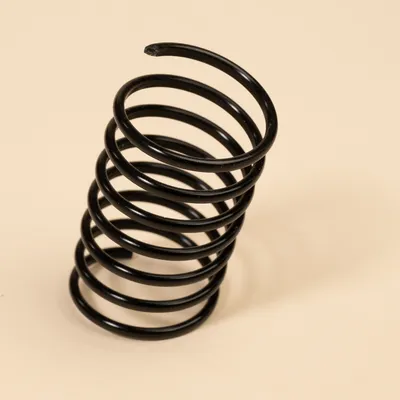 Sort metalspiral, egnet til reparation eller udskiftning af kradsetrædele.