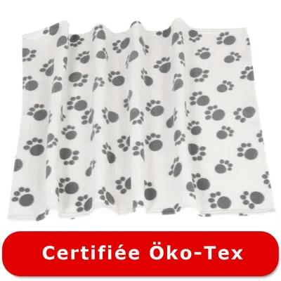 Plaid en tissu blanc à motifs pattes noires, texte visible : Certifiée Öko-Tex Plaid en tissu blanc à motifs pattes noires, texte visible : Certifiée Öko-Tex