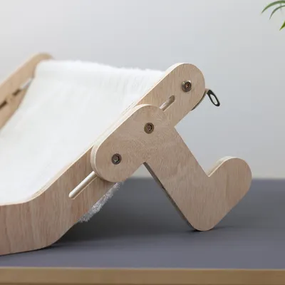 Wooden frame with white fabric cover, suitable for pet furniture or accessories. Visible screws and metal brackets.