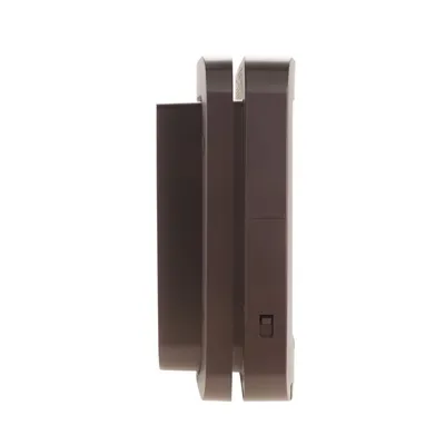 Side view of a brown electronic device with a visible switch, showing its thickness and design details.