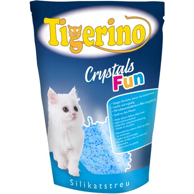 Balení Tigerino Crystals Fun Silikatstreu s obrázkem bílého kotěte, modrými silikátovými krystaly a textem o vlastnostech steliva v několika jazycích.