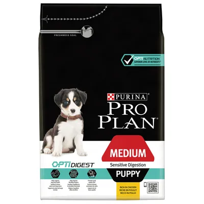 Saco de alimento para perros Purina Pro Plan Medium Sensitive Digestion Puppy, OPTIDIGEST, rico en pollo. Texto visible en inglés y francés. Sellos de frescura y nutrientes superiores.