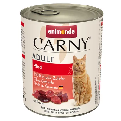 Animonda Carny Adult wołowina. 100% świeżych składników, bez zbóż, Made in Germany. Z tauryną. Przedstawienie kawałków mięsa i czerwonego napisu.