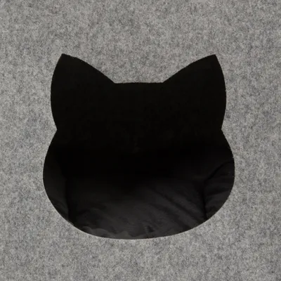 Grey felt surface with black cut-out in cat head shape, suitable as entrance to a pet bed or hideaway.