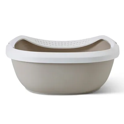 Bac à litière en plastique beige avec rebord blanc et surface perforée sur le dessus, sans marque visible.