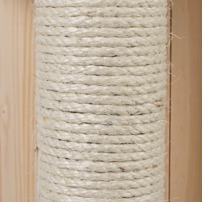 Close-up of light sisal rope wrapped around a wooden post. Material for scratching posts or other pet furniture visible.