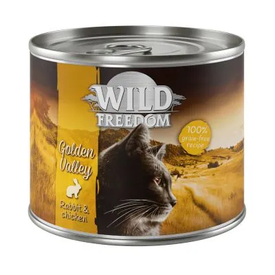 Scatoletta Wild Freedom Golden Valley Rabbit & Chicken, 100% grain-free recipe, immagine di un gatto nero su sfondo paesaggio dorato. Testo visibile: Golden Valley, Rabbit & chicken.
