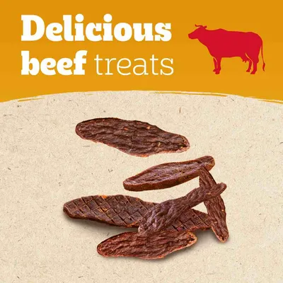 Delicious beef treats text with red cow icon above several pieces of dried brown beef treats on beige background. No brand name visible.