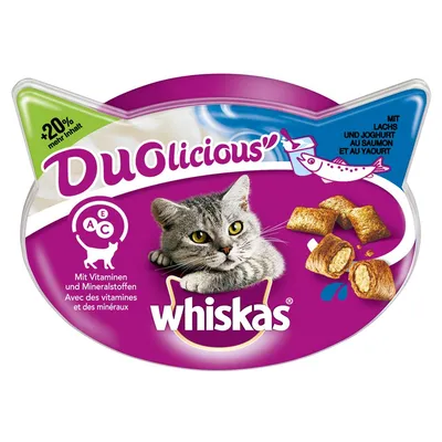 Envase Whiskas Duolicious con imagen de gato, trozos rellenos, texto '+20% mehr Inhalt', 'Mit Lachs und Joghurt', y vitaminas A, C, E. Marca Whiskas visible en el centro.