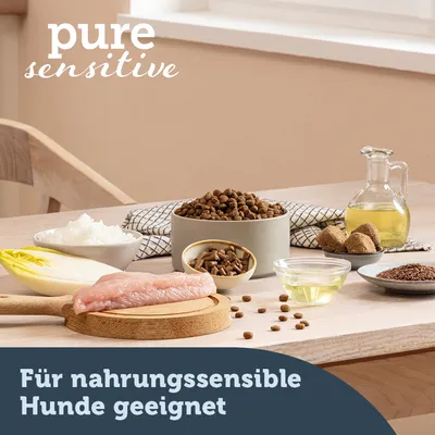 pure sensitive. Für nahrungssensible Hunde geeignet (texte en allemand). Ingrédients visibles : filet de viande crue, endive, riz, croquettes, huile, graines, boulettes.