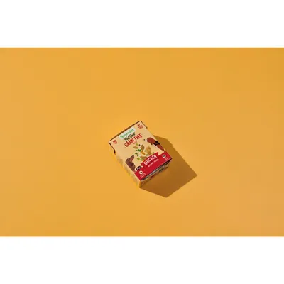 Box labelled grain free chicken, with images of food and animals, placed on a plain background. Key visible information: grain free, chicken flavour.
