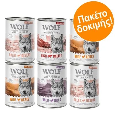 Wolf of Wilderness κονσέρβες σκύλου 400g: Great Desert, High Valley, Wide Acres, Wild Hills. Πορτοκαλί σήμανση με κείμενο 'Πακέτο δοκιμής!'.